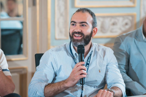 Dr. Moustafa Awad speaking during a Plug and Play session.