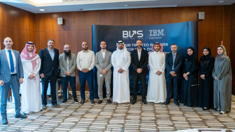 Dr. Moustafa Awad with banking clients at an industry event in Saudi Arabia.