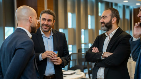Dr. Moustafa Awad speaking at a banking industry event in Saudi Arabia.