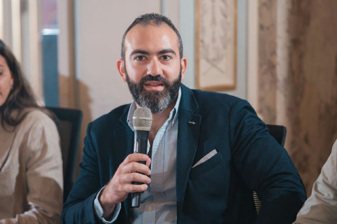 Dr. Moustafa Awad speaking at Plug and Play Demo Day.