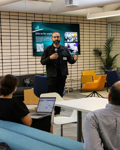 Dr. Moustafa Awad speaking to startup founders in Palo Alto.