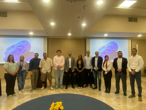 Dr. Moustafa Awad with the AUC AI in Financial Services cohort at the end of the program.